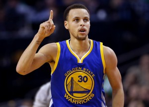 Golden State Warriors guard Stephen Curry heads down the court after making a three point shot during the second half of the Golden State Warriors 106-101 win over the Boston Celtics in an NBA basketball game in Boston, Sunday, March 1, 2015. (AP Photo/Winslow Townson)