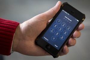 FILE - In this Feb. 17, 2016 file photo an iPhone is seen in Washington. FBI Director James Comey hinted at an event in London on Thursday, April 21, 2016, that the FBI paid more than $1 million to break into the locked iPhone used by one of the San Bernardino attackers. (AP Photo/Carolyn Kaster, File)