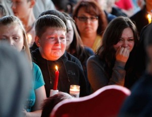 Supporters grieve at a candlelight vigil after the shooting at Reynolds High School in Troutdale, Ore.