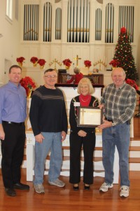 Rev. Doug Forbes and Rev. Bruce Smith present Rev. Dennis and Elaine O’Neill with a Certificate of Appreciation to acknowledge their concern for and assistance to disaster victims.  (Left to right are Rev. Bruce Smith, Rev. Dennis and Elaine O’Neill and Rev. Doug Forbes.)