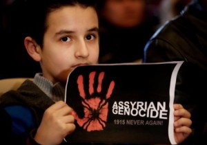An Assyrian boy holds a poster during a sit-in for abducted Christians in Syria and Iraq, at a church in east Beirut, Lebanon. Associated Press/Photo by Hussein Malla