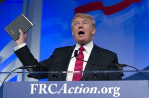 Republican presidential candidate, businessman Donald Trump, holds up his bible who was giving to him by his mother as he speaks during the Values Voter Summit, held by the Family Research Council Action, Friday, Sept. 25, 2015, in Washington ( AP Photo/Jose Luis Magana) ORG XMIT: DCJL120