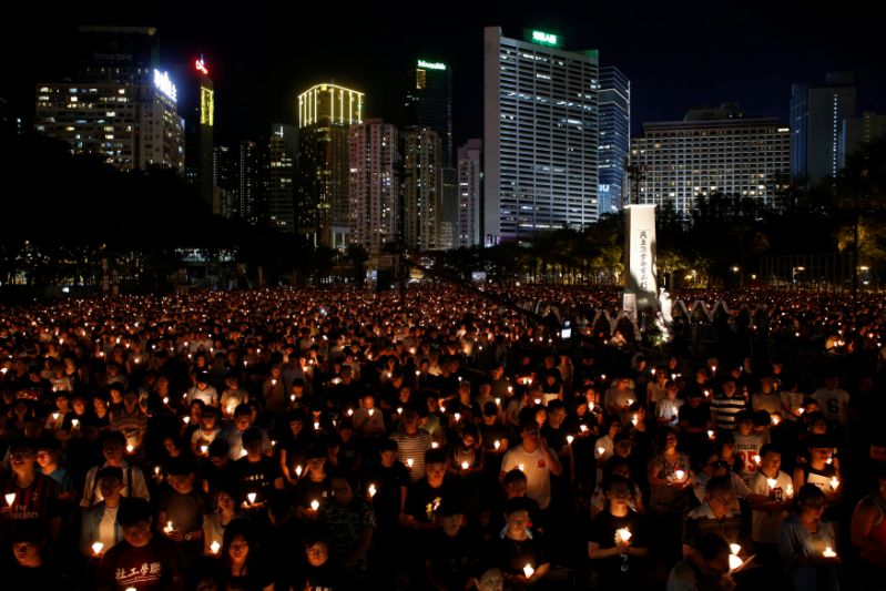 Thousands of people take park in a candlelight vigil to mark the 27th anniversary of the crackdown of pro-democracy movement at Beijing's Tiananmen Square in 1989, at Victoria Park in Hong Kong June 4, 2016. REUTERS/Bobby Yip TPX IMAGES OF THE DAY