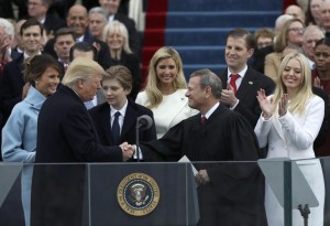 U.S. President Donald Trump shakes hands with U.S. Supreme Court Chief Justice John Roberts (R) after being sworn in as president with his wife Melania, and children Barron, Donald, Ivanka and Tiffany at his side during inauguration ceremonies at the Capitol in Washington, U.S.,  January 20, 2017. REUTERS/Carlos Barria