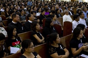 Ethnic Kachin people gather to pray for two female Kachin volunteer teachers, Monday, Jan. 26, 2015, at headquarters of Kachin Baptist Association in Yangon, Myanmar. The United States has called on authorities to investigate allegations by activists that the women were raped and killed by army soldiers. (AP Photo/Khin Maung Win)