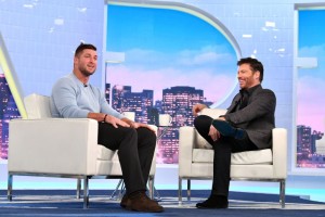 Tim Tebow appearing with Harry Connick Jr.