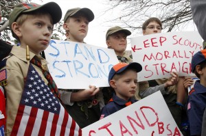 (clockwise from left) Boy Scouts Eric Kusterer, Jacob Sorah, James Sorah, Micah Brownlee and Cub Scout John Sorah hold signs at the “Save Our Scouts” Prayer Vigil and Rally in front of the Boy Scouts of America National Headquarters in Irving, TX Wednesday, February 6, 2013. (AP Photo/Richard Rodriguez)