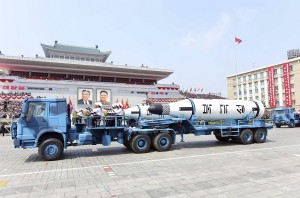 In this Saturday, April 15, 2017, photo distributed by the North Korean government, Polaris submarine launched ballistic missiles (SLBM) are paraded to celebrate the 105th birth anniversary of Kim Il Sung, the country's late founder, in Pyongyang, North Korea. China is defending its trade practices with North Korea after Chinese-made vehicles were seen carrying ballistic missiles during a military parade despite international sanctions against selling military hardware to Pyongyang. (Korean Central News Agency/Korea News Service via AP)