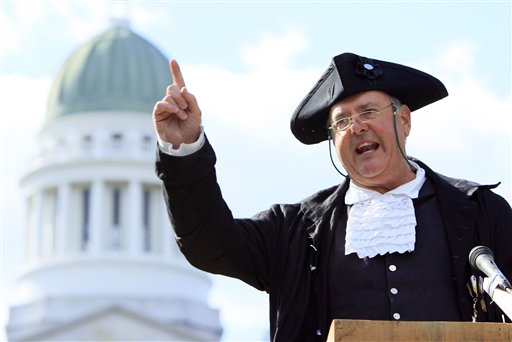 Garrett Lear, the Patriot Pastor, of Wakefield, N.H., addresses a crowd at a tea party rally in Capitol Park, Thursday, April 15, 2010, in Augusta, Maine. (AP Photo/Robert F. Bukaty)