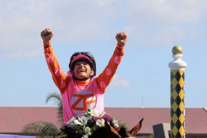 DEL MAR, CA - NOVEMBER 04:  Jockey Mike Smith celebrates after riding Caledonia Road to a win in the  14 Hands Winery Breeders' Cup Juvenile Fillies race on day two of the 2017 Breeders' Cup World Championship at Del Mar Race Track on November 4, 2017 in Del Mar, California.  (Photo by Sean M. Haffey/Getty Images)
