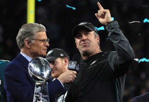 MINNEAPOLIS, MN - FEBRUARY 04:  Head coach Doug Pederson of the Philadelphia Eagles celebrates with the Vince Lombardi Trophy as he is interviewed by NBC personality Dan Patrick after defeating the New England Patriots 41-33 in Super Bowl LII at U.S. Bank Stadium on February 4, 2018 in Minneapolis, Minnesota.  (Photo by Mike Ehrmann/Getty Images)